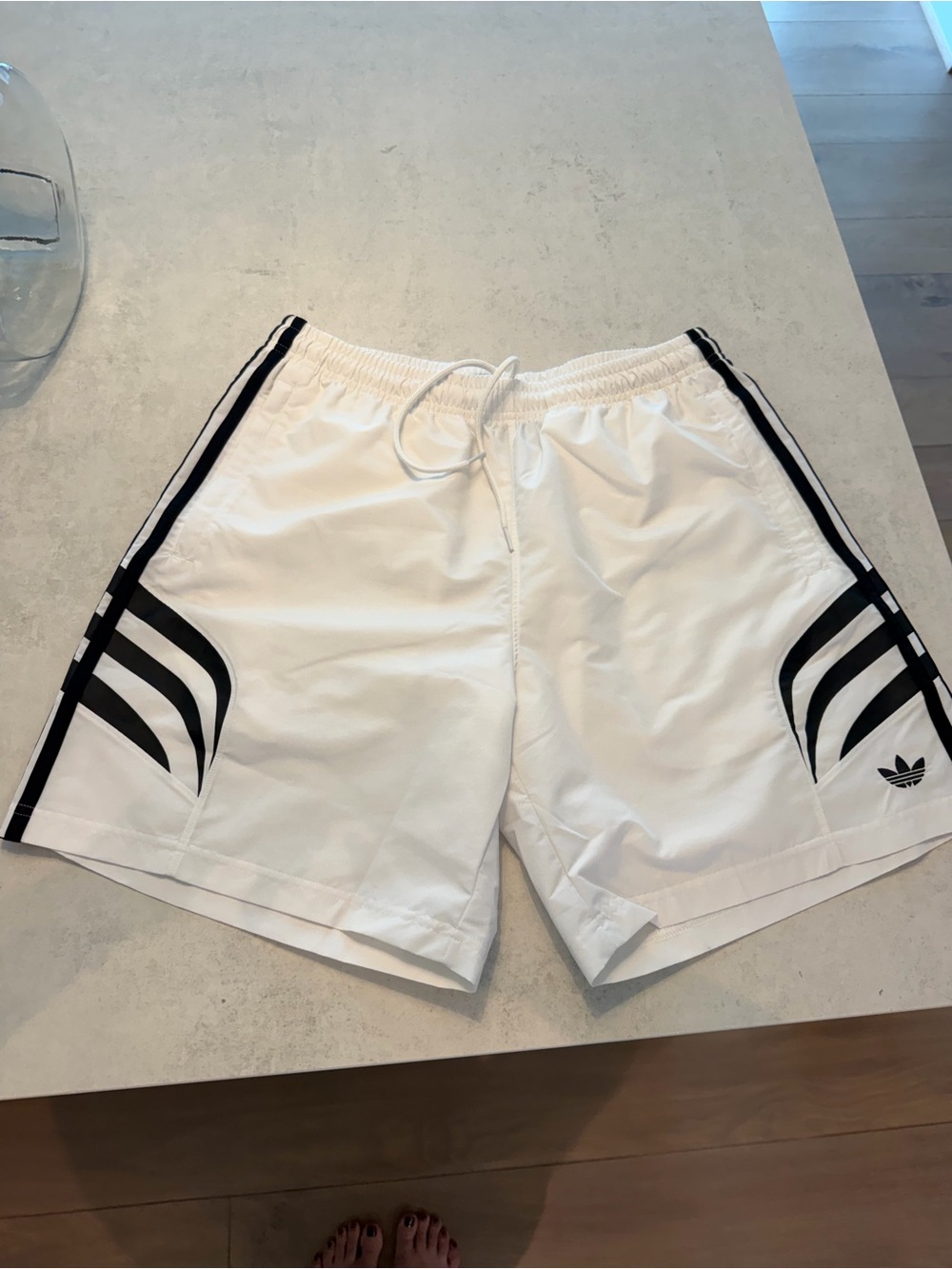 adidas White Athletic Shorts with Black Three-Stripe Accents
